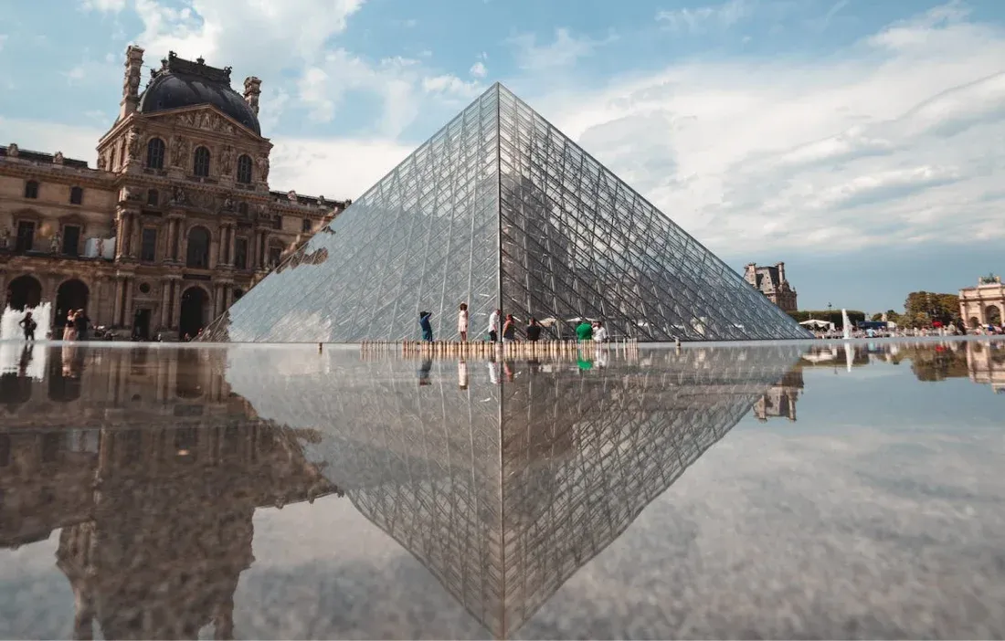 people in front of the louvre museum